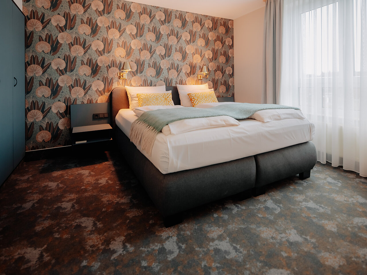 Panorama Suite im CASCADA Hotel Rheine – Modern & großzügig Weitläufige Panorama Suite mit modernem Interieur im CASCADA Hotel Rheine